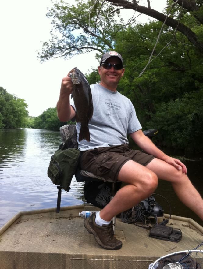 Successful angler with 15-inch fish in Ramsey