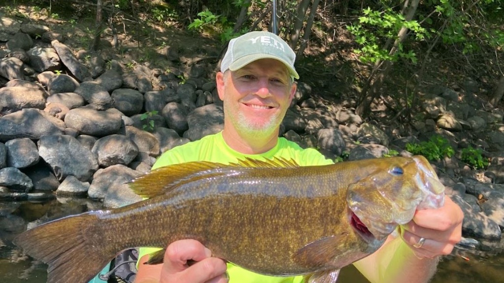 A person fishing in a lake in Minnesota