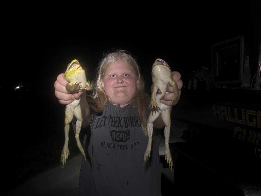Two freshly caught fish being displayed after successful fishing trip in Delavan WI
