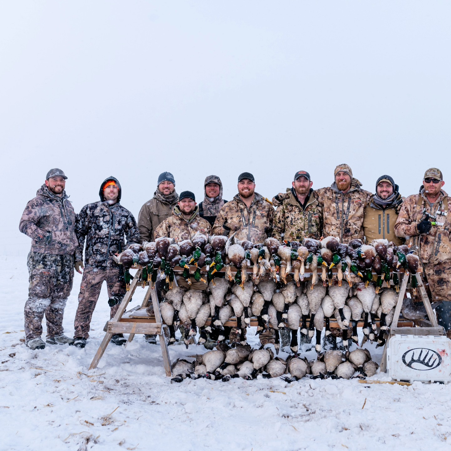 Group of 10 people enjoying fishing and hunting activities in Johnstown