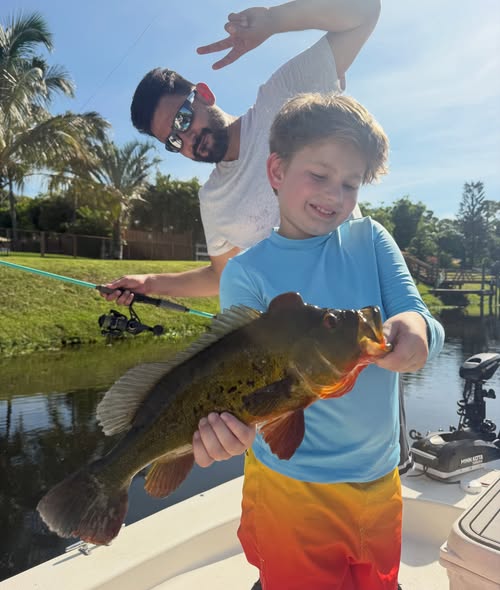 Peacock bass catch during fishing trip in Delray Beach FL