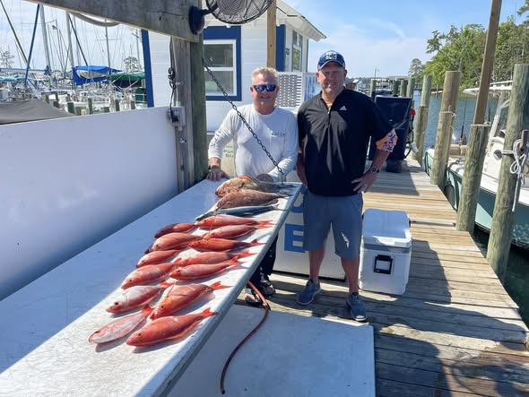 Fresh caught red snapper displayed on fishing boat deck at marina in Niceville FL