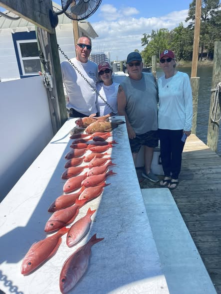Fresh caught red snapper displayed on fishing boat deck in Niceville FL