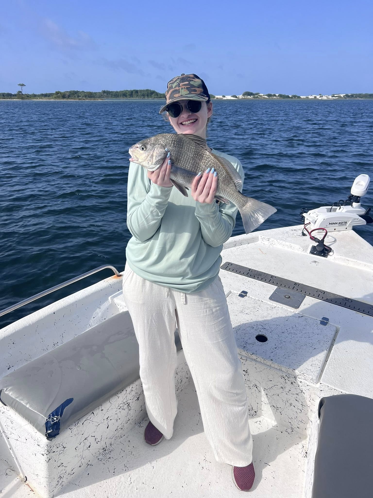 Anglers catch a 17-inch black drum on Okaloosa Island