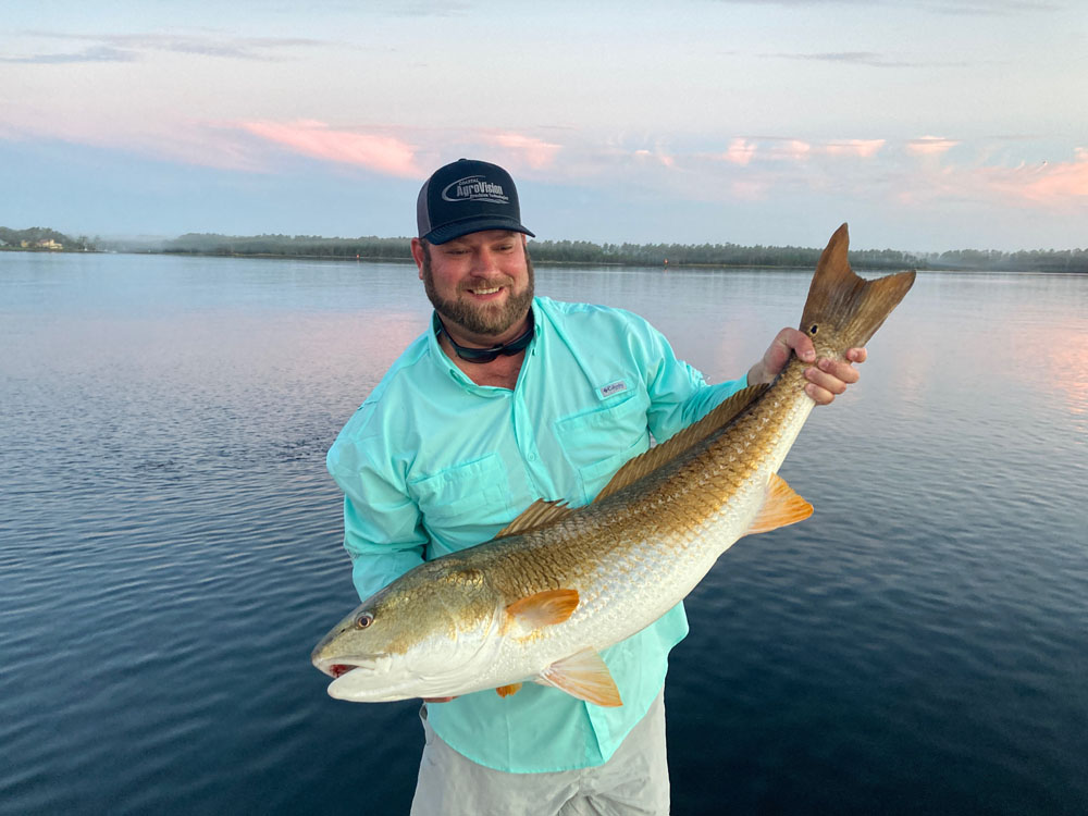 Angler with a large 22-inch fish in Wrightsville Beach