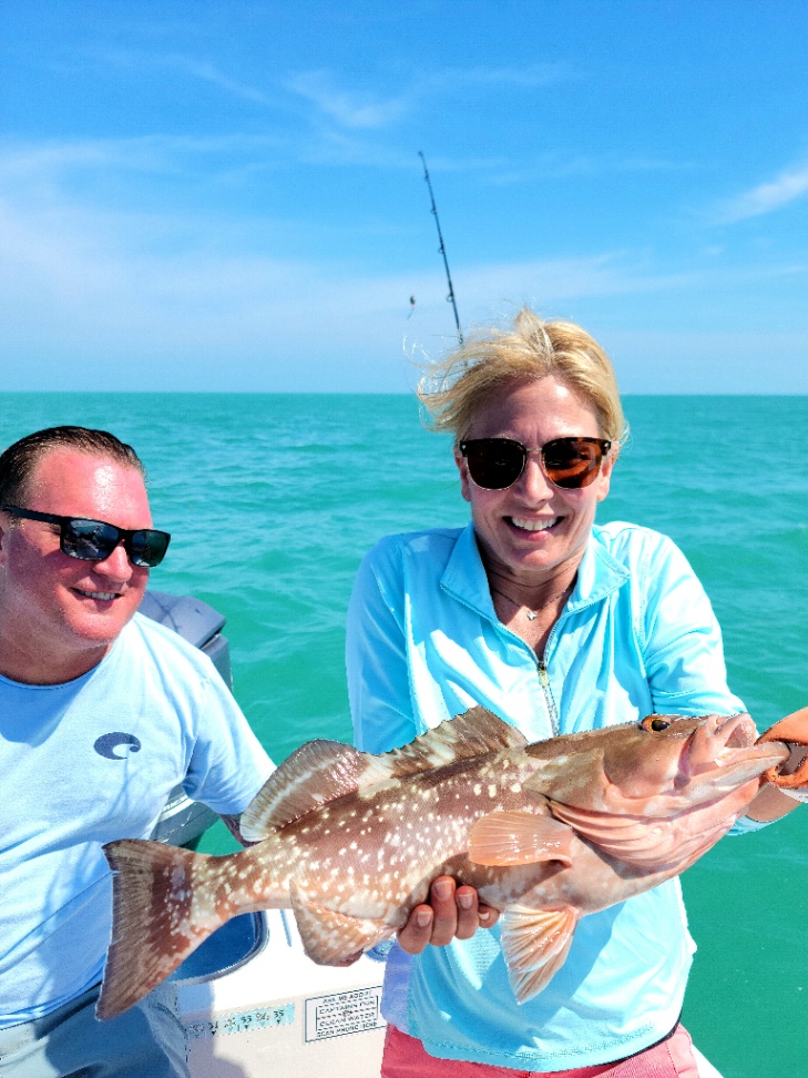 Two people fishing with poles in Florida