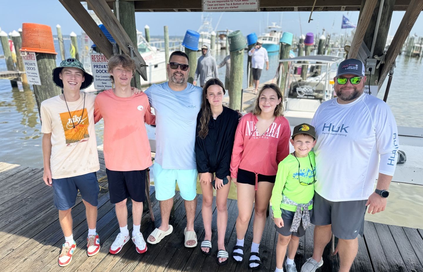 Group of 8 people enjoying a fishing trip