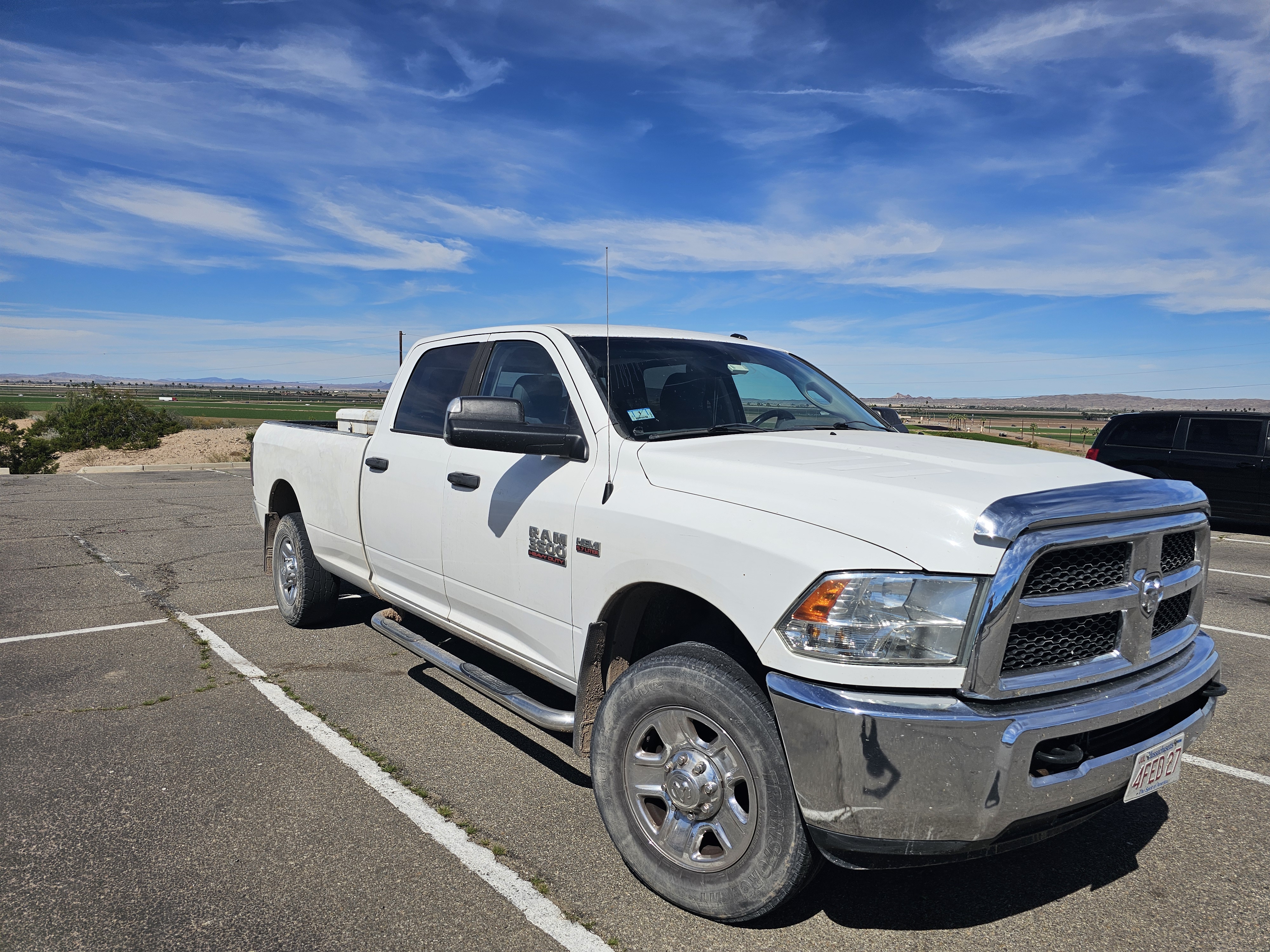 White pickup truck parked in parking lot in Yuma AZ for tours