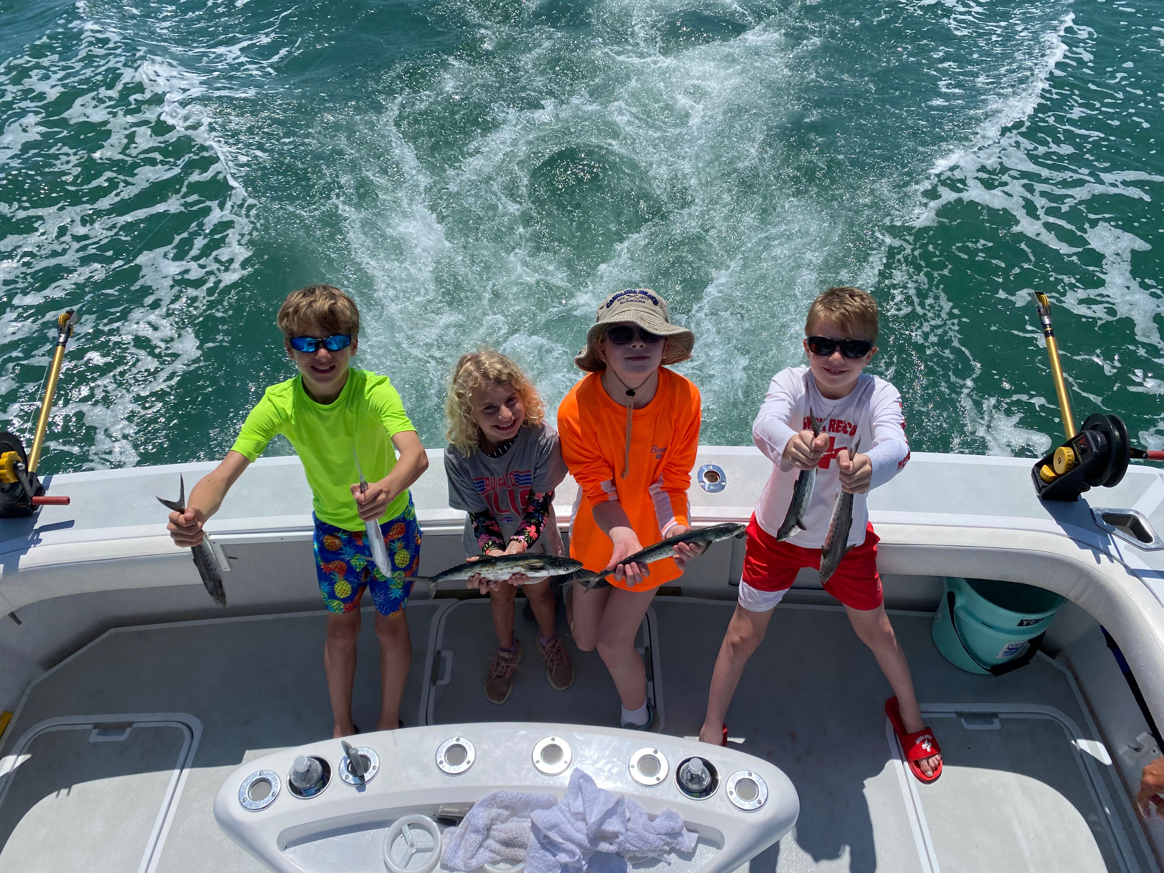 Four people fishing at Carolina Beach