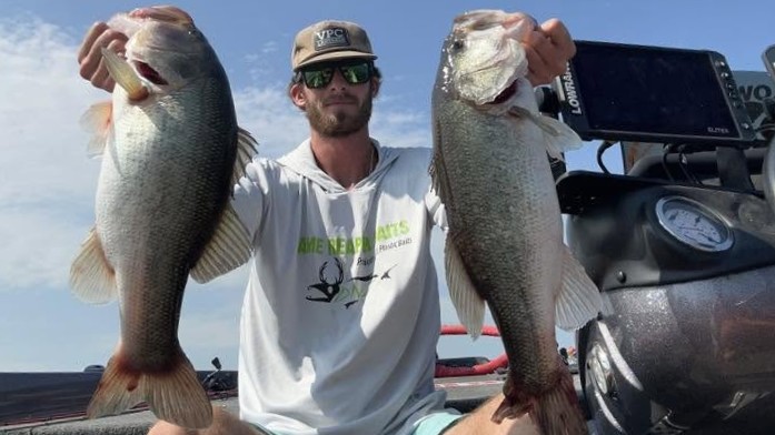 Two large bass caught fishing in Moncure NC displayed on boat