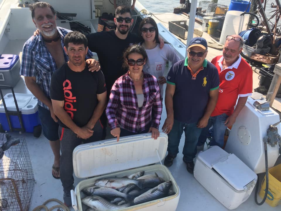 7 people fishing together in Deale