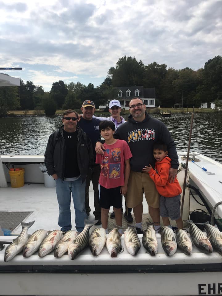 Group of 6 people fishing in Deale