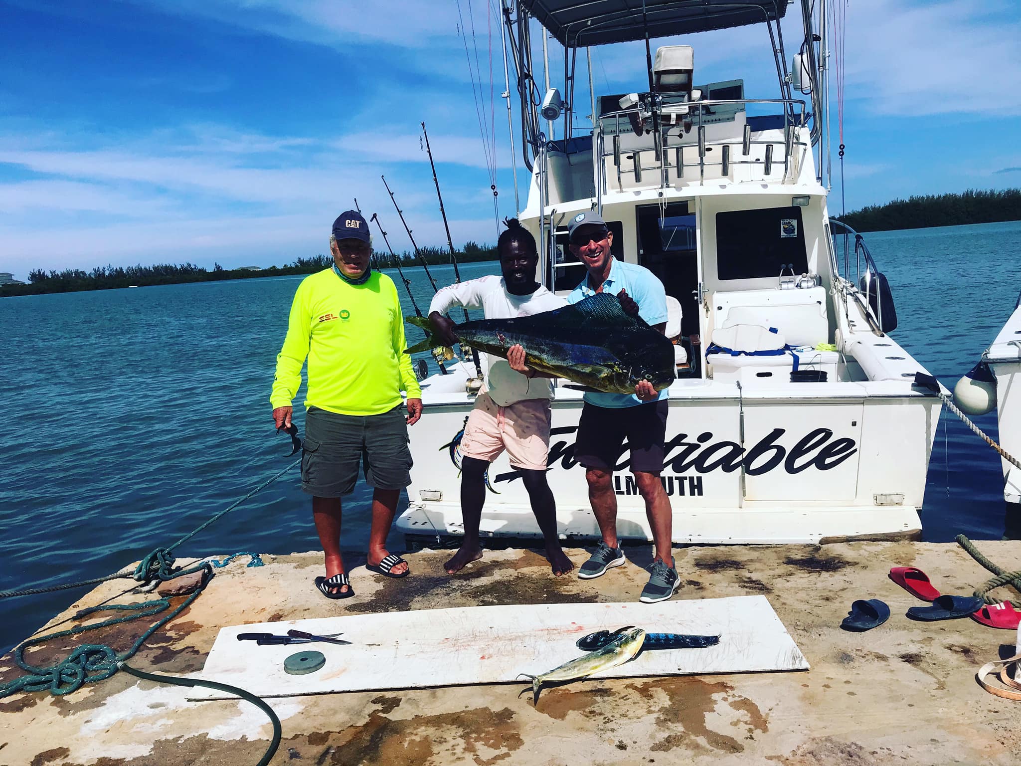 Successful mahi mahi fishing trip in Falmouth with fresh catch displayed on dock