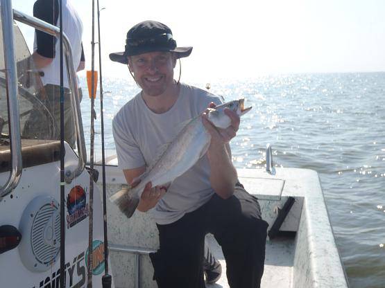 A lone angler with a 13-inch fish in TX