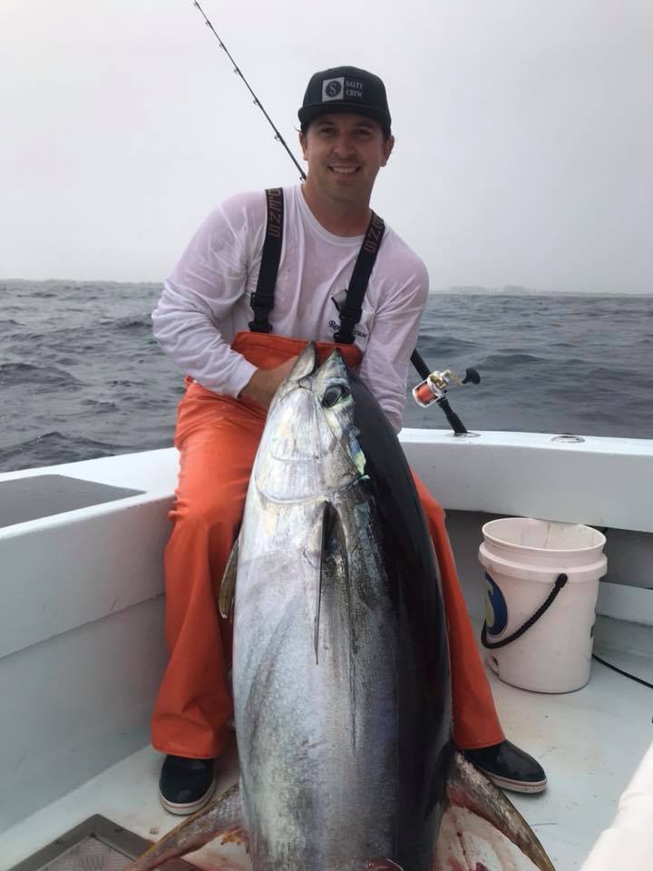A lone angler holds a 28-inch catch in FL
