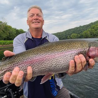 A large 27-inch rainbow trout caught in Branson, Missouri while fishing.