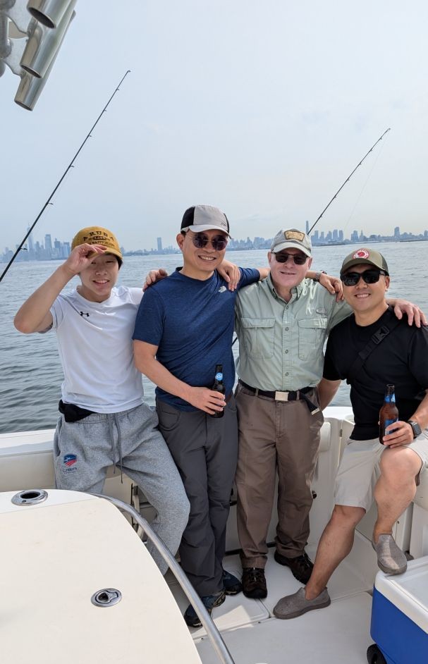 Four people fishing in the beautiful outdoors of NJ