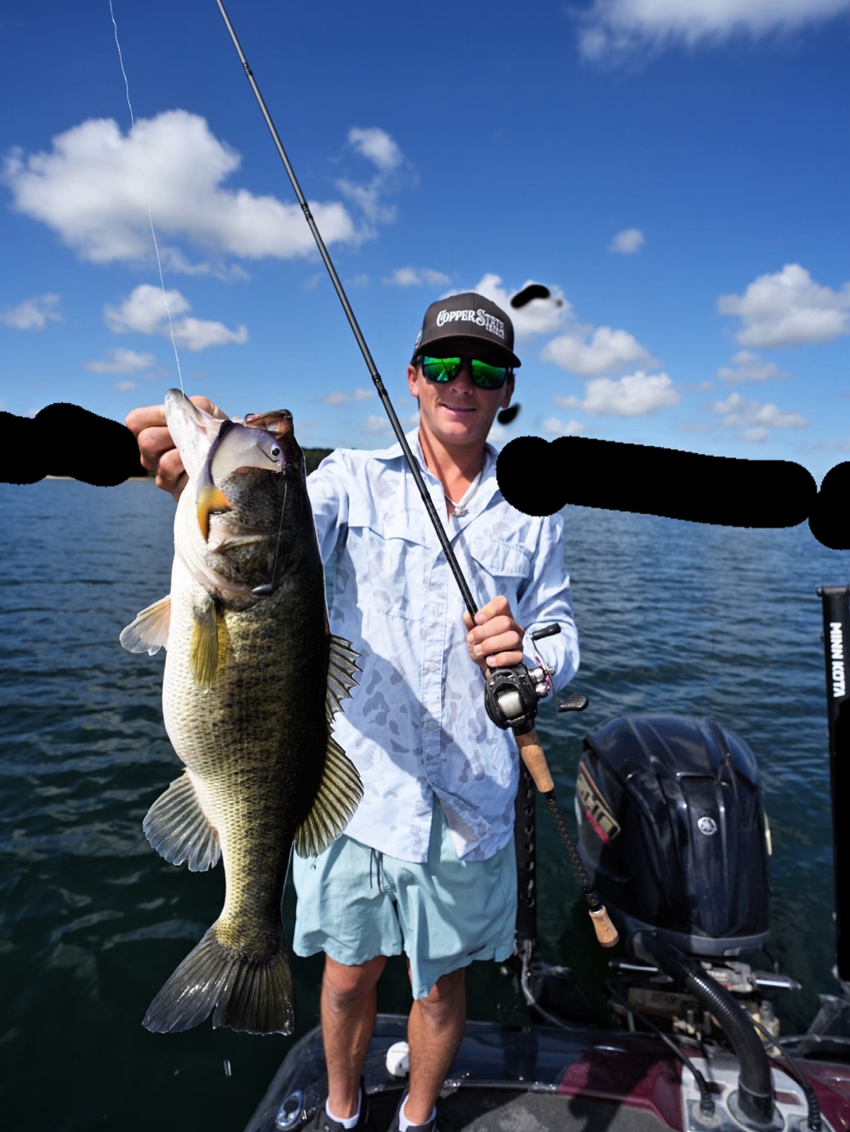 Large bass fish being held on fishing boat in Davie FL waters