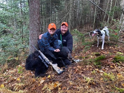 Two people enjoying fishing and hunting in Maine