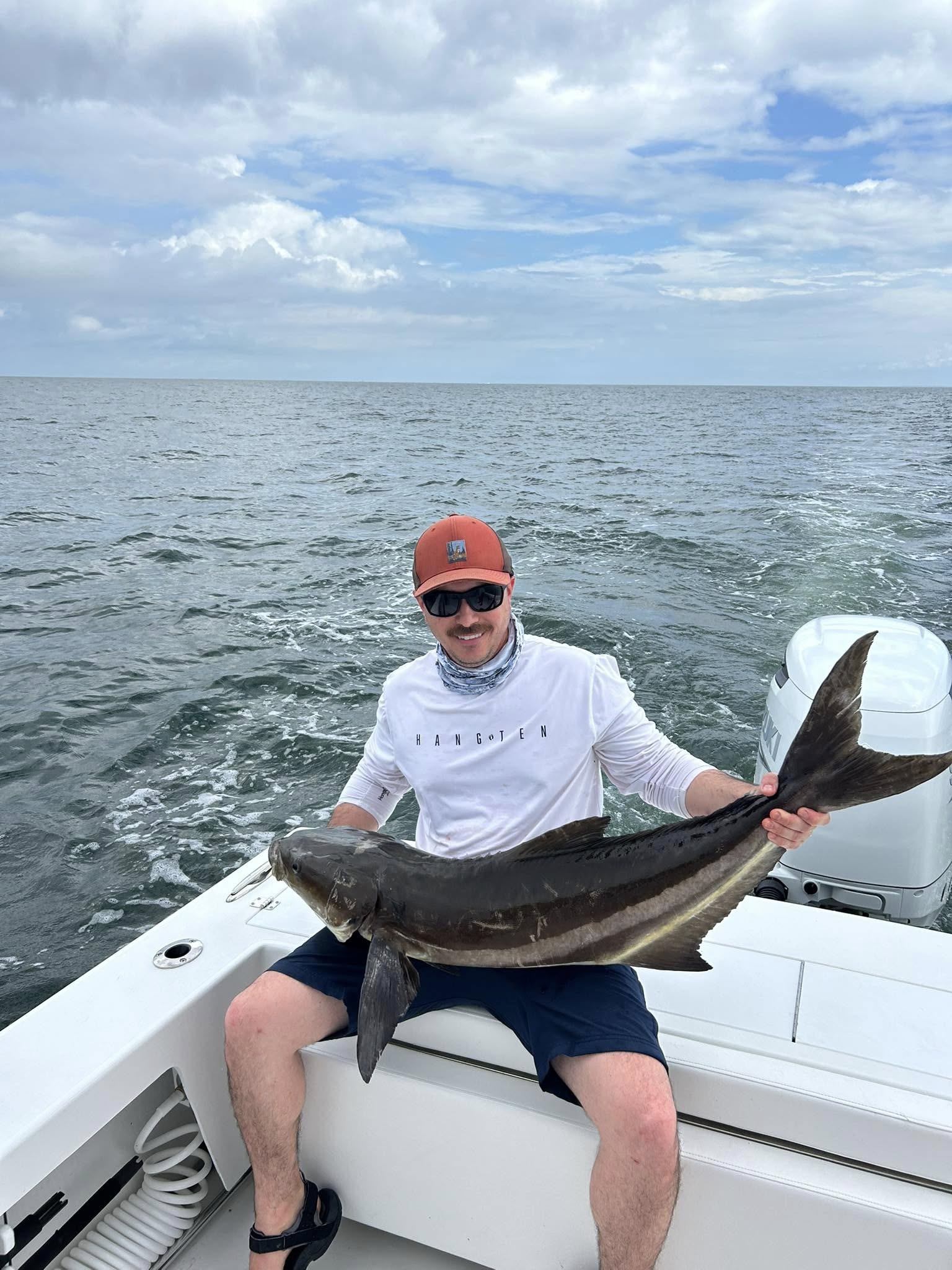 Angler catches a Cobia fish in Virginia Beach