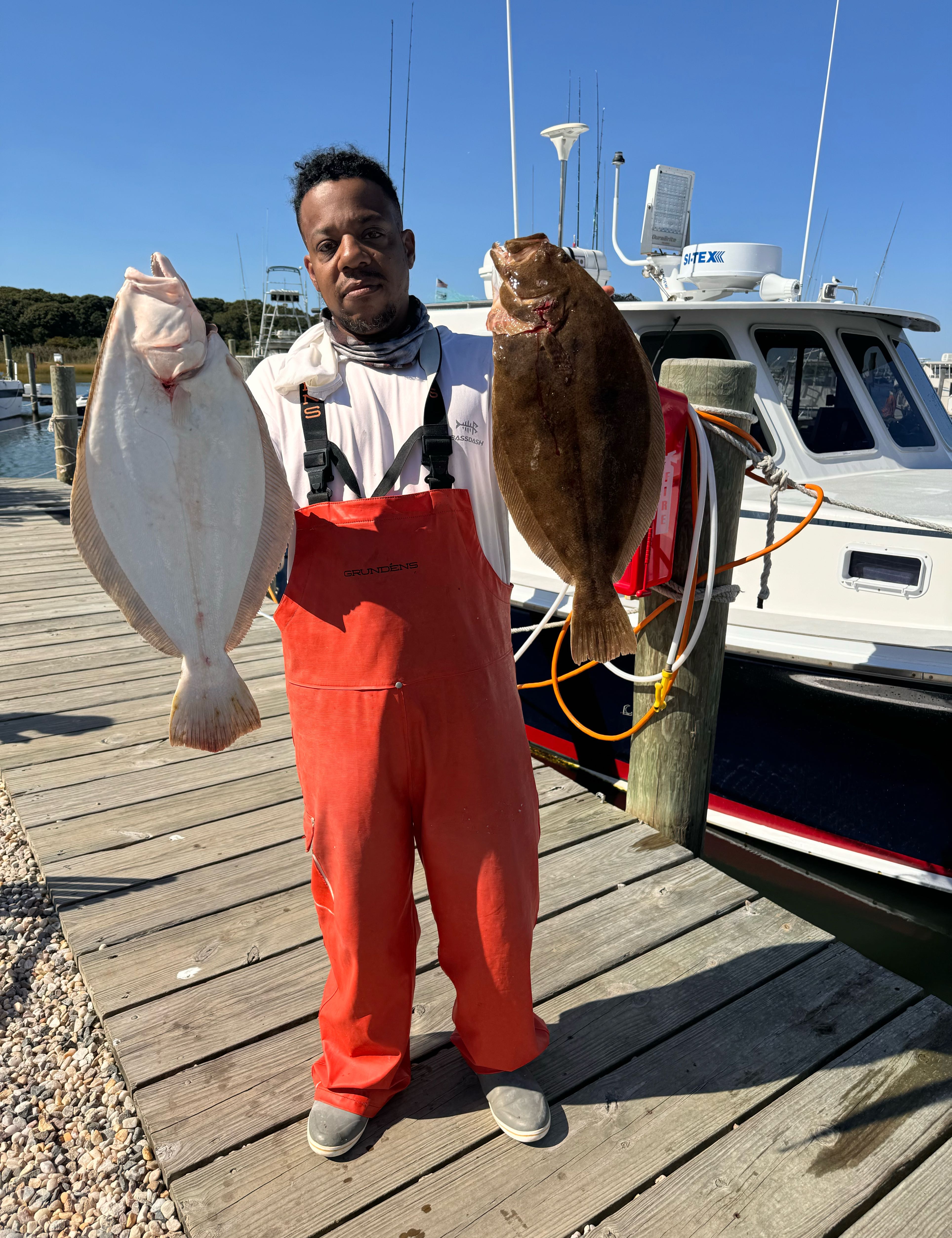 Two southern flounder, 23 inches long, caught while fishing in Syosset