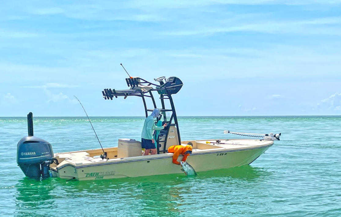 Scenic view of Holmes Beach, Florida with fishing rod in the foreground