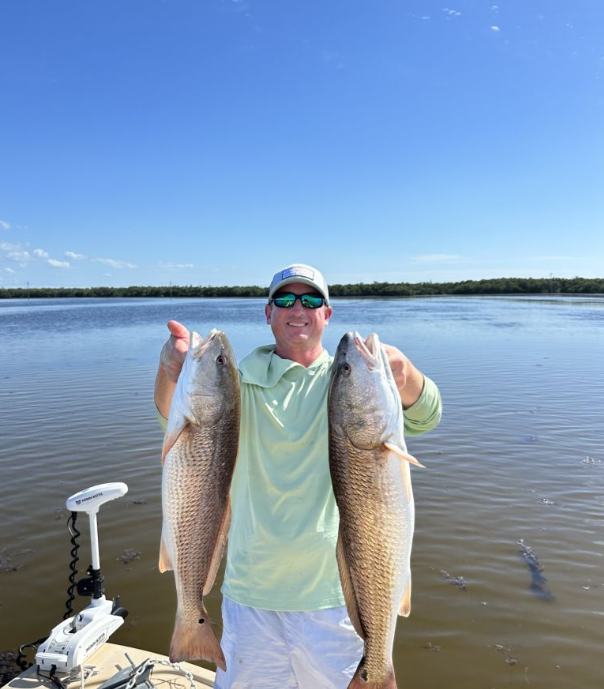 Two redfish, 30-inch fish caught while fishing in FL