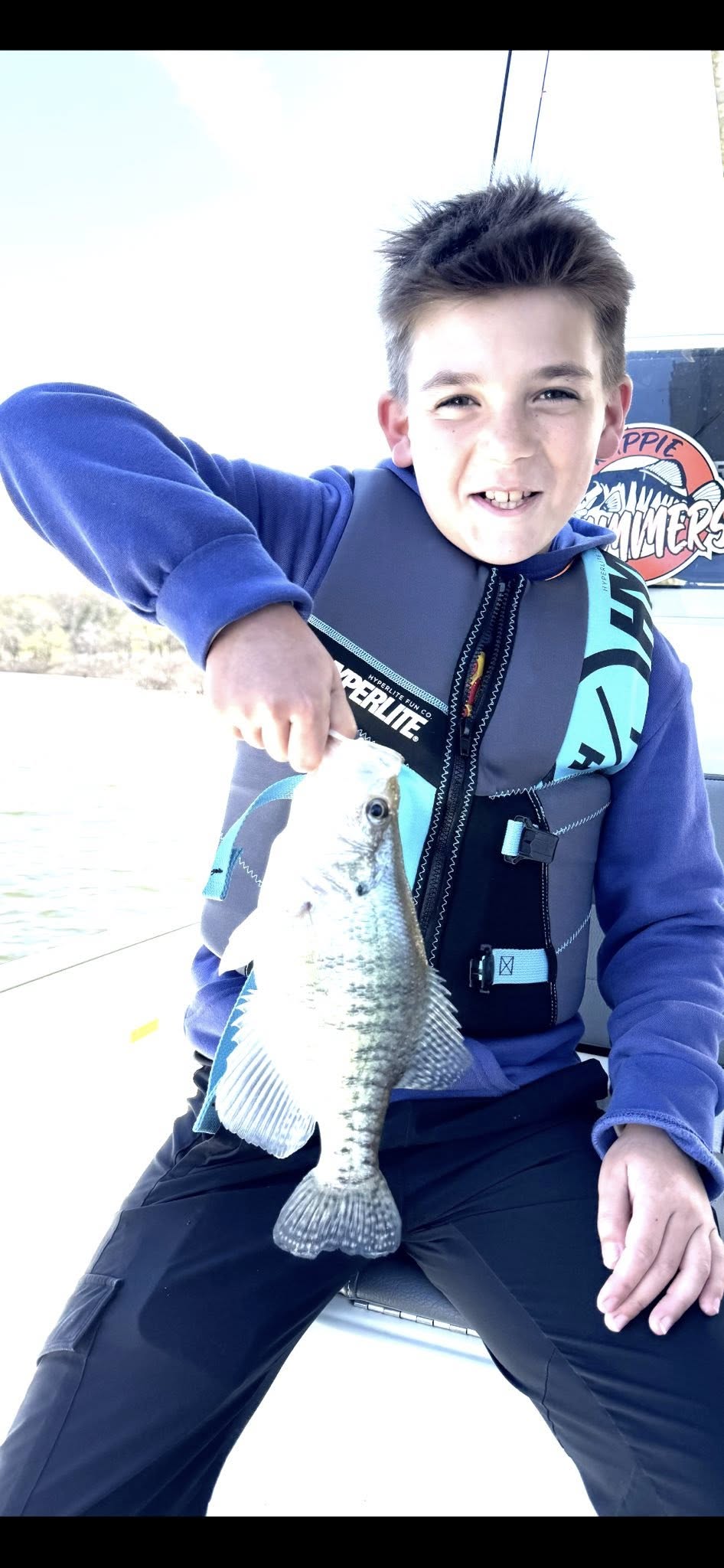 Freshly caught fish being held up after successful fishing trip in Pittsburg MO