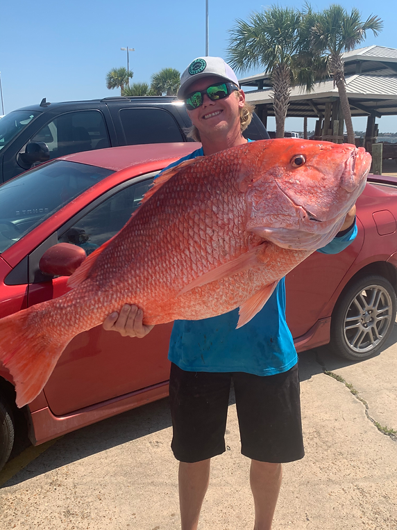 Angler with a black grouper fish in Panama City