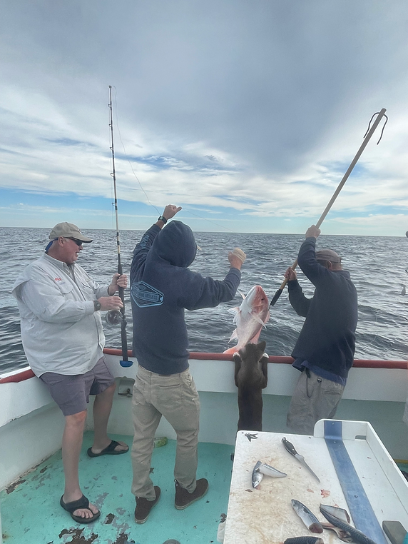 Fisherman standing in Panama City, holding fishing rod