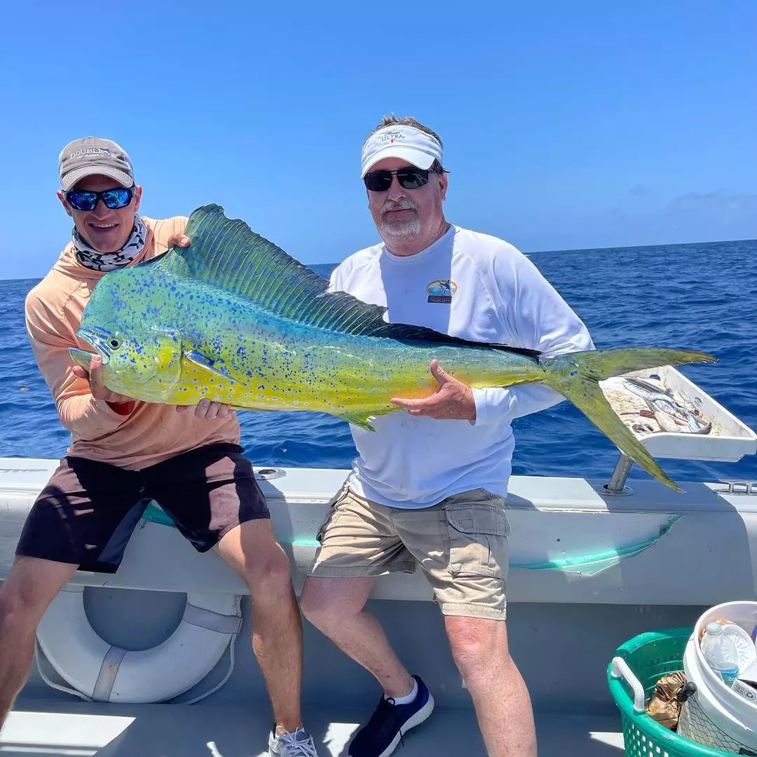 Two people fishing on a boat in Key West