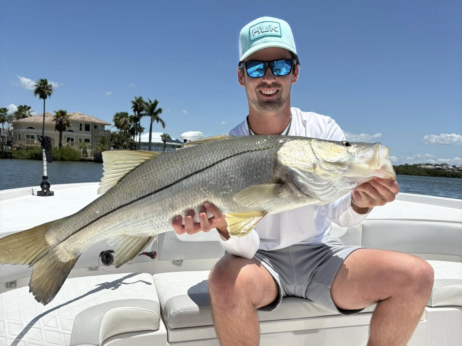Tampa Bay inshore fishing charter boat with captain and anglers catching snook and redfish