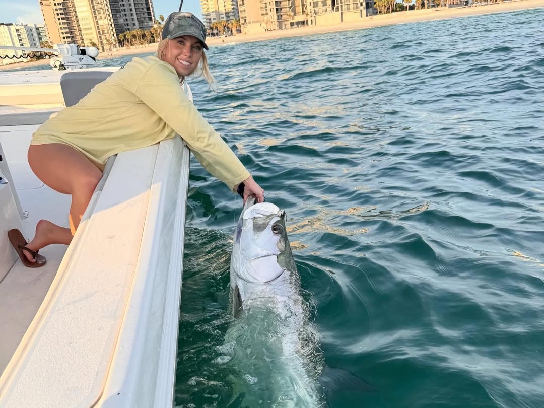 Tampa Bay tarpon fishing charter boat with captain and anglers targeting silver king inshore