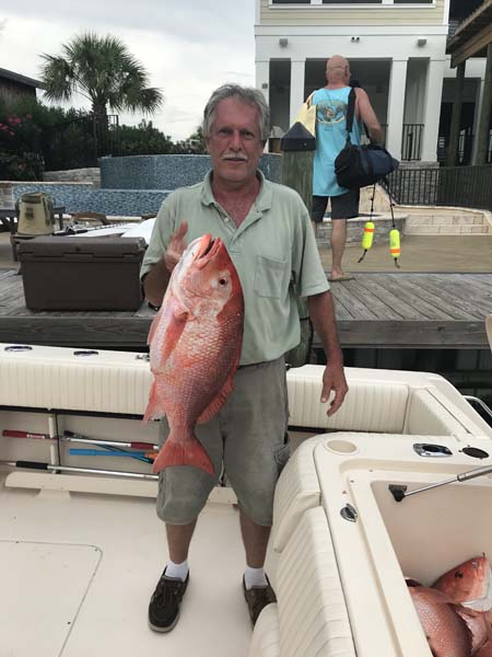 One fisherman in FL catching a 19-inch fish with fishing equipment