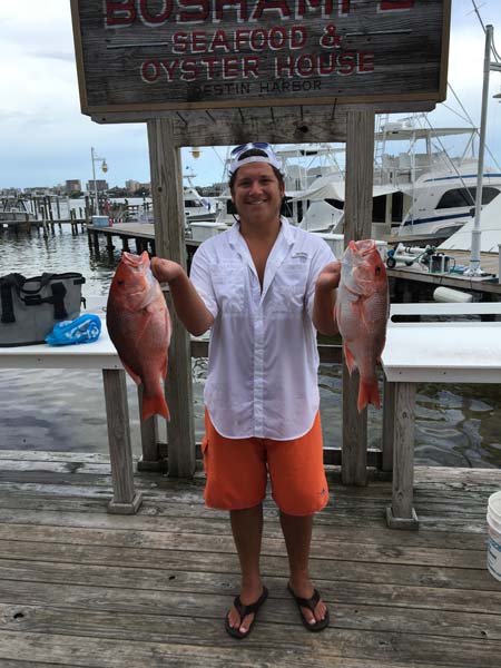 1 person fishing in Destin with 2 small fish
