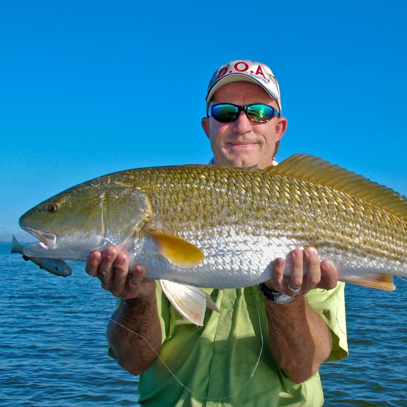 Angler fishing in Florida with a 24-inch fish