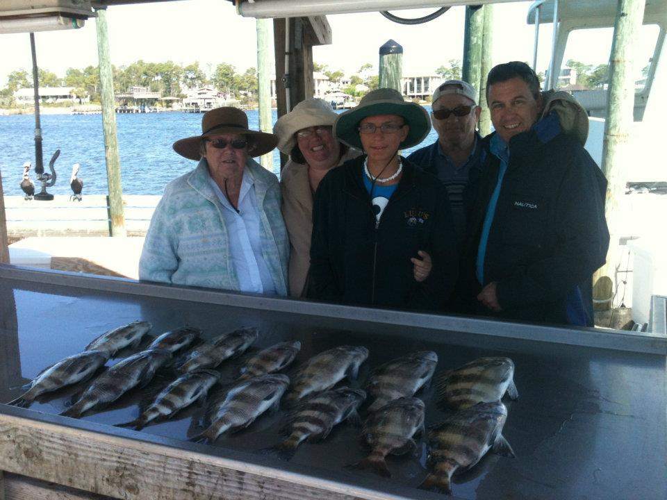 5 people enjoying fishing trip at Orange Beach
