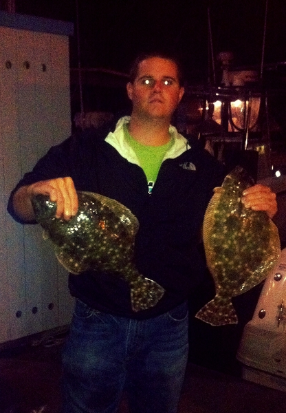Anglers hold 2 Southern Flounder in Galveston