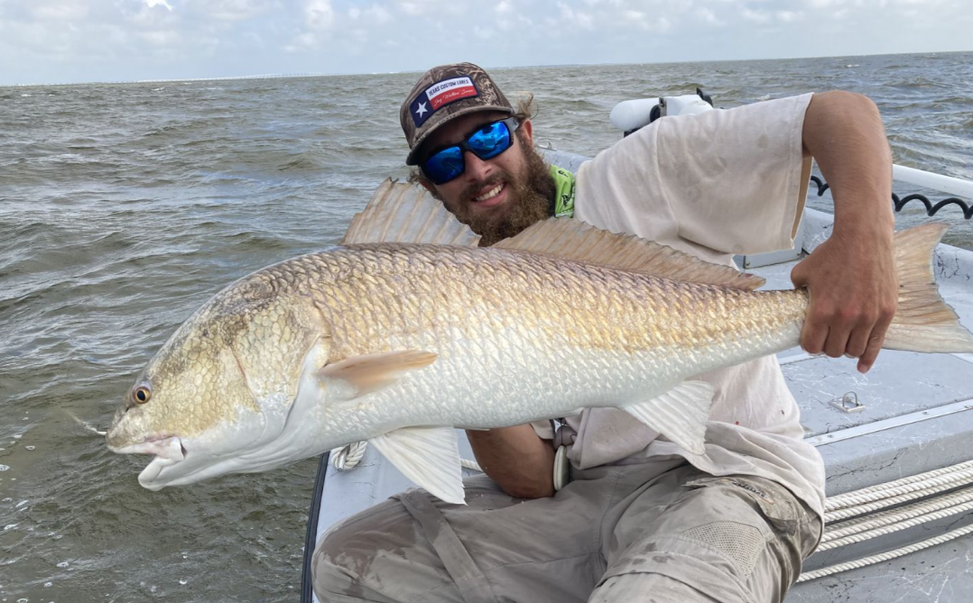A fisherman with a 30-inch fish in Rockport