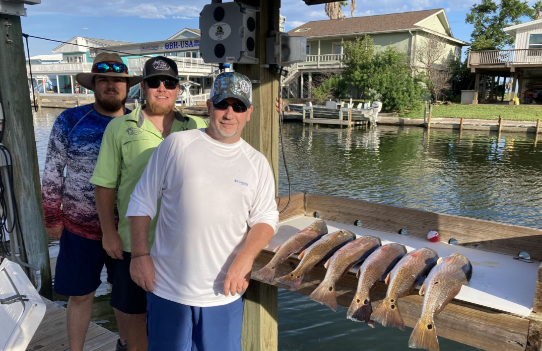 Two redfish being caught in Rockport