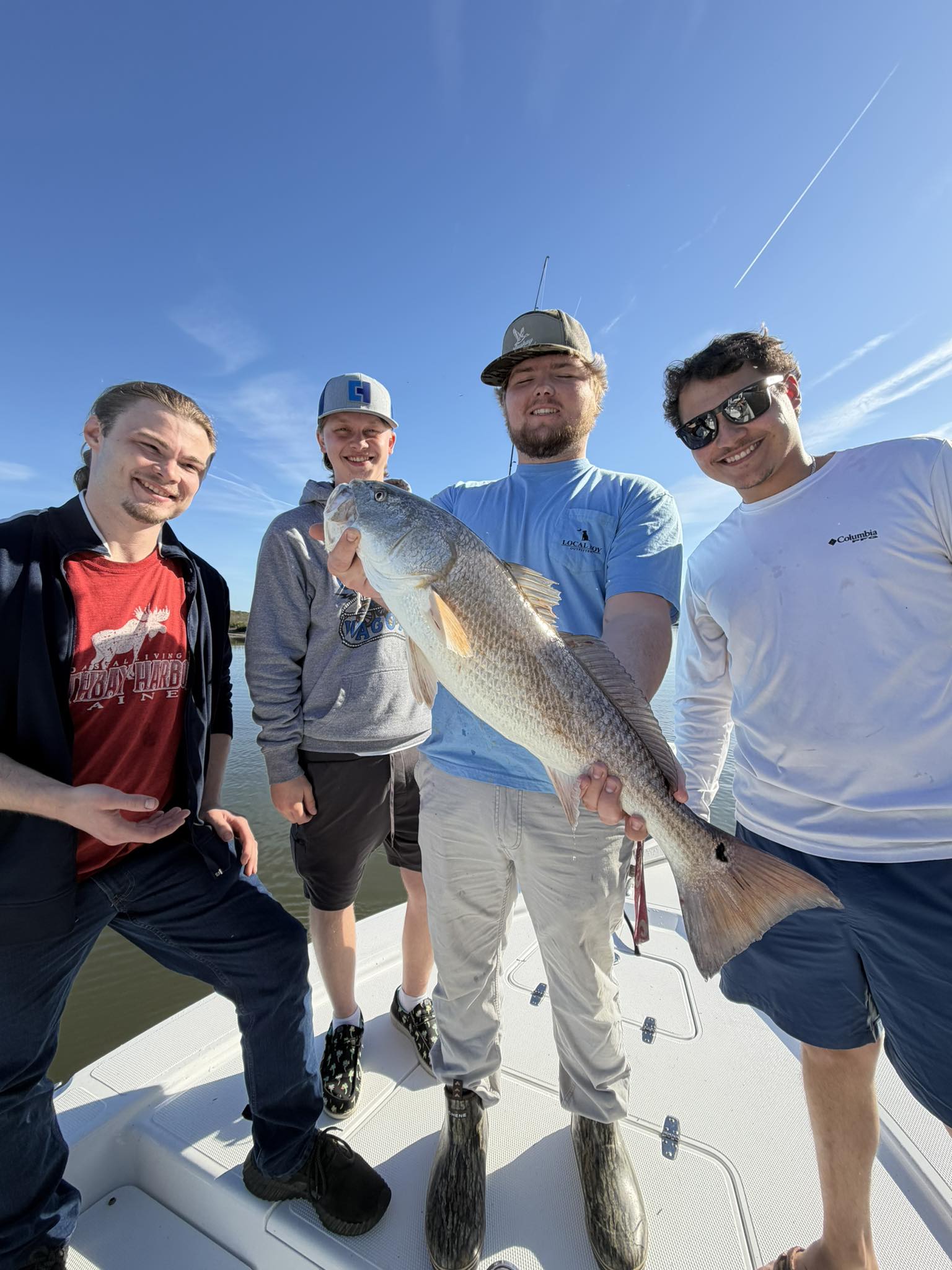 Successful redfish catch on fishing charter boat in Edisto Beach SC