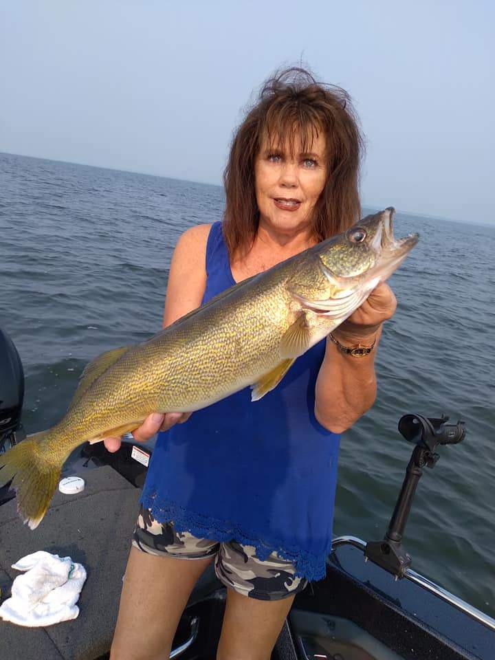 Angler holding a 22-inch fish in WI