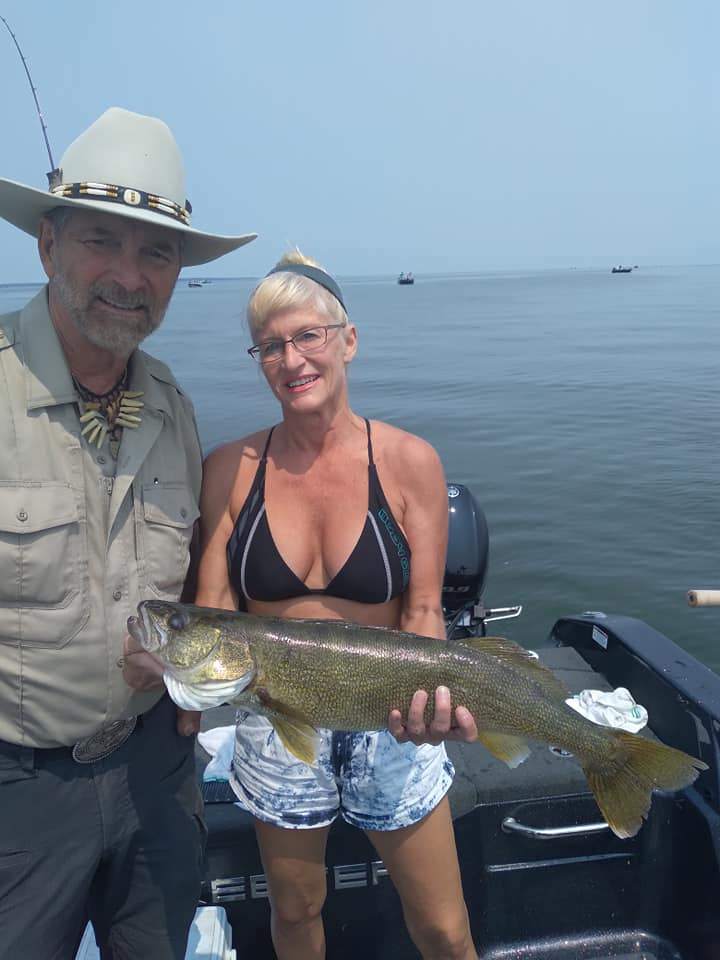 Three people fishing in WI