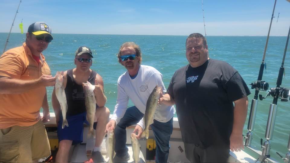 Successful walleye fishing trip in Port Clinton OH with fresh catch displayed on boat