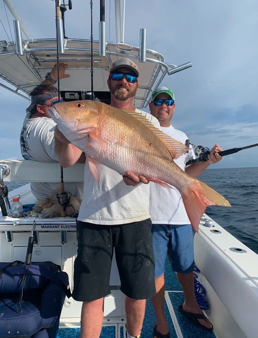 Three people enjoying a day of fishing in Saint Augustine