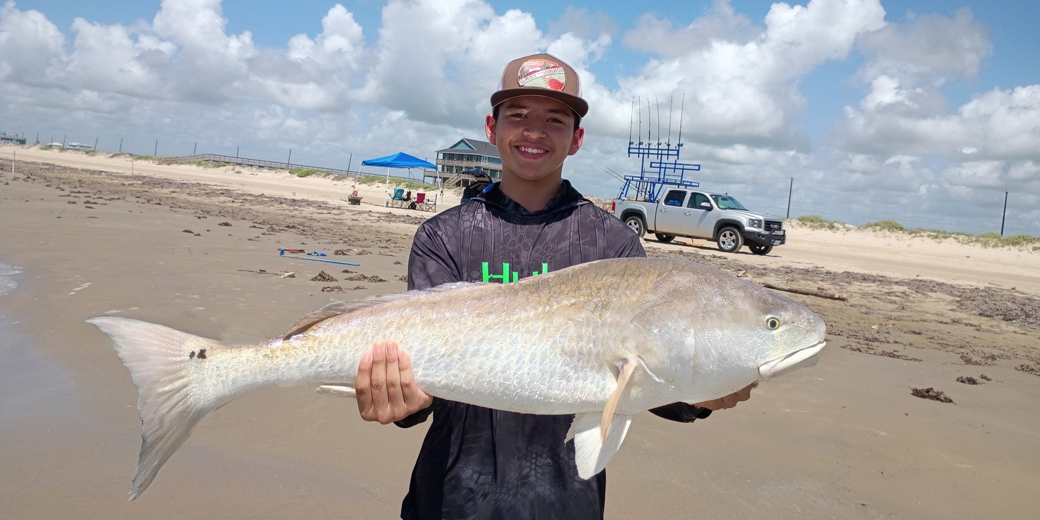 Texas surf fishing guide on Bolivar beach targeting redfish and sharks from shore