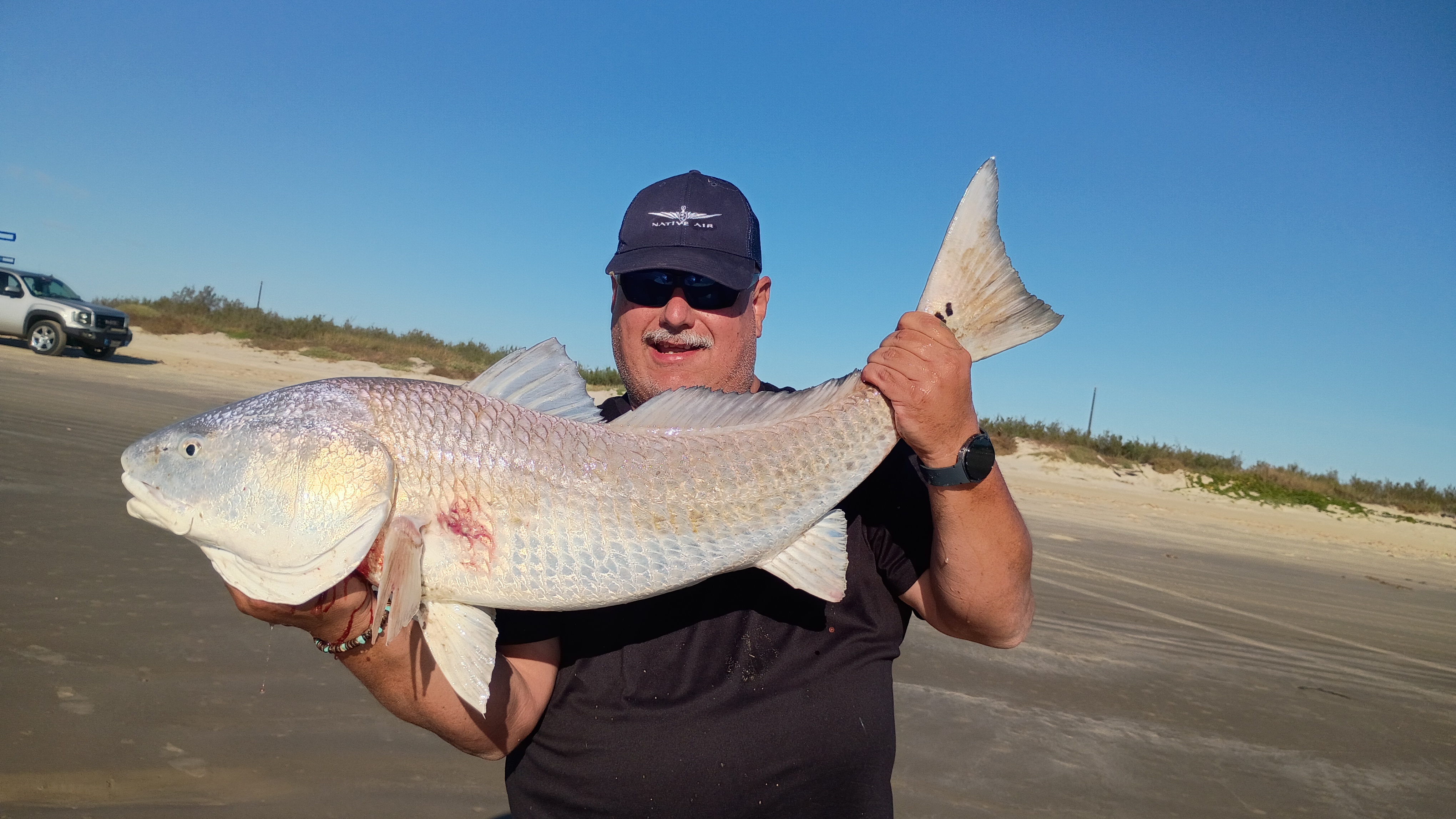 Captain Jeffrey Millet surf fishing guide on Galveston Jamaica Beach targeting redfish and shark