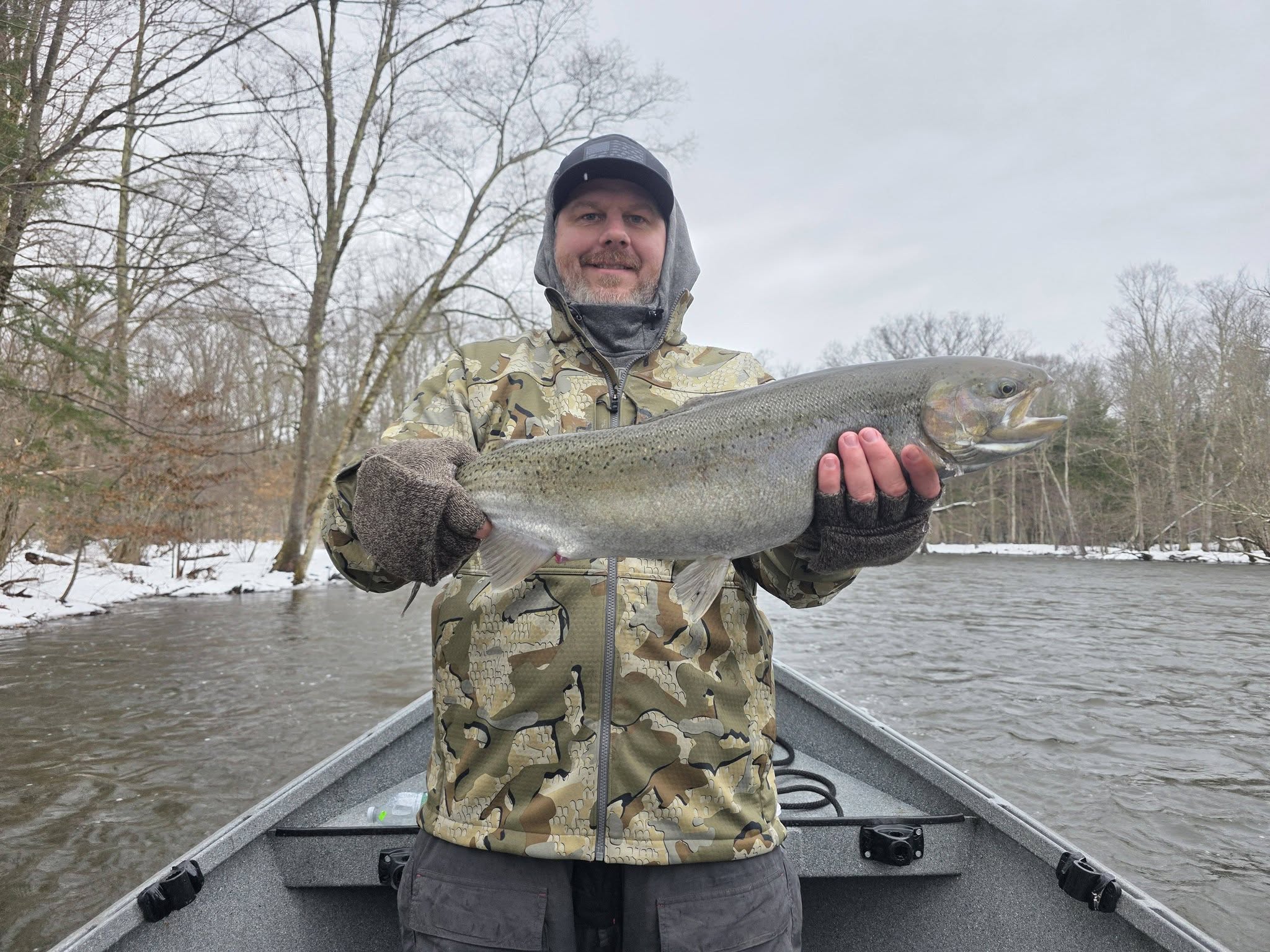 Rainbow trout catch displayed on boat in Ellisburg NY winter fishing trip