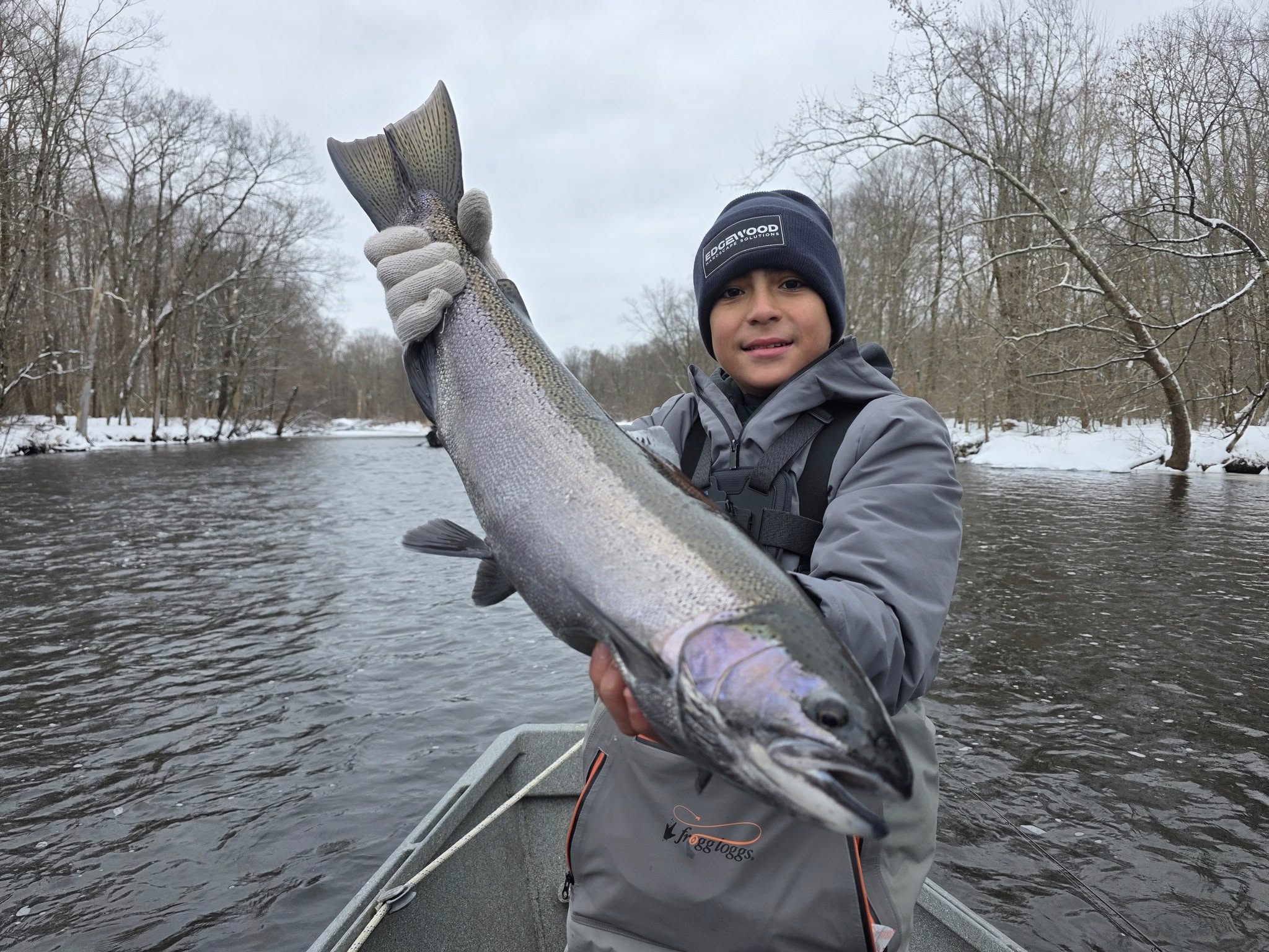Coho salmon catch displayed on boat in winter river setting near Ellisburg NY