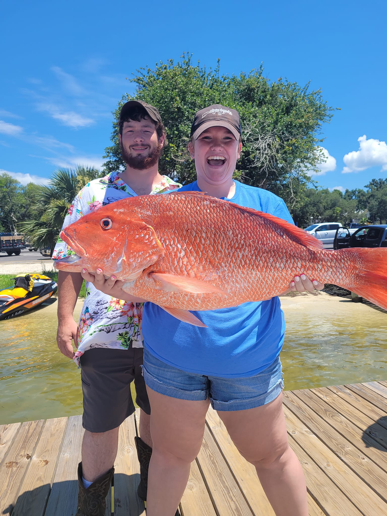 A couple enjoys fishing at the beautiful Orange Beach